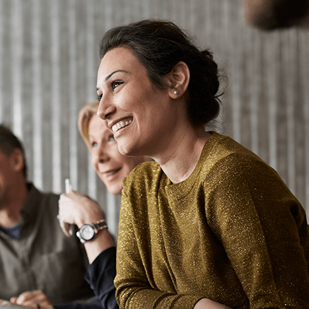 business woman in meeting smiling